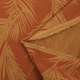 Viscose imprimée feuilles de palmier fond orange brûlé