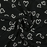 Viscose légère imprimée cœurs fond noir