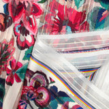 Mousseline imprimée bande satin carnaval de fleurs fond nacre