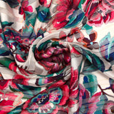 Mousseline imprimée bande satin carnaval de fleurs fond nacre