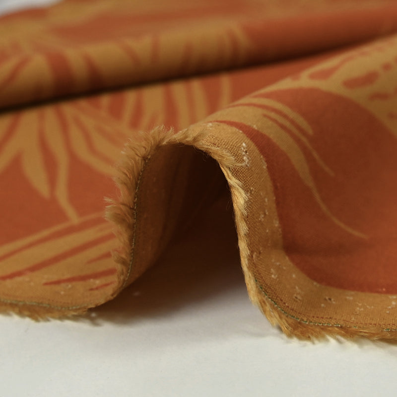 Viscose imprimée feuilles de palmier fond orange brûlé