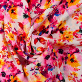 Viscose imprimée danse de fleurs jaune et rose fond blanc