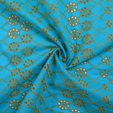 Broderie anglaise festonnée beige Clémence fond bleu azur