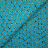 Broderie anglaise festonnée beige Aurélia fond bleu azur