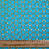 Broderie anglaise festonnée beige Aurélia fond bleu azur