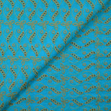 Broderie anglaise festonnée beige Éléonore fond bleu azur