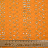 Broderie anglaise festonnée beige Clémence fond orange