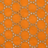 Broderie anglaise festonnée beige Aurélia fond orange