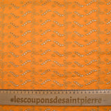 Beige scalloped English embroidery Éléonore orange background