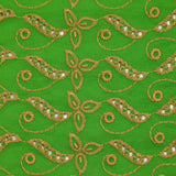 Broderie anglaise festonnée beige Éléonore fond vert pomme