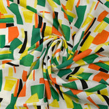 Viscose imprimée graphique orange, jaune et vert fond blanc