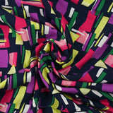Viscose imprimée graphique fuchsia, mauve et vert fond marine