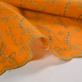 Beige scalloped English embroidery Éléonore orange background
