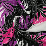 Viscose imprimée végétation tropicale rose et violet fond noir