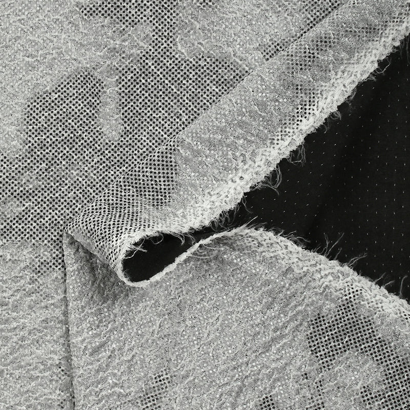 Maille texturée imprimée terre en pointillé fond gris