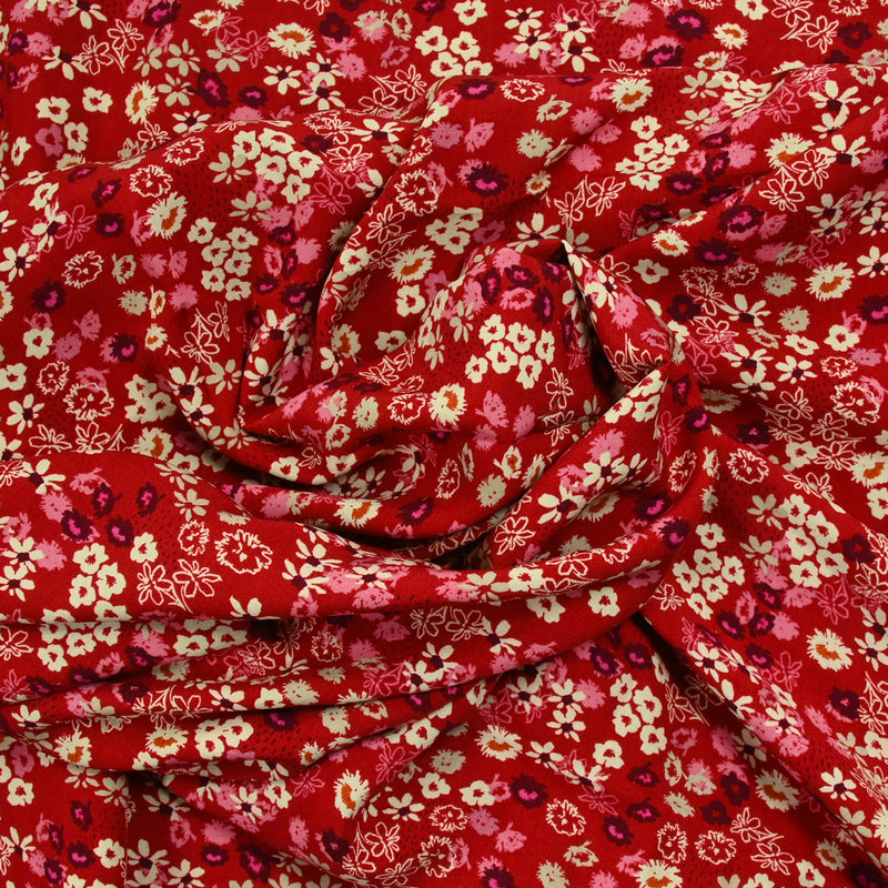 Viscose imprimée tourbillon de fleurs fond rouge