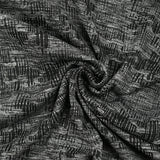 Maille texturée folie invasive gris et noir