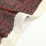 Mousseline de polyester imprimée léopard marron et noir