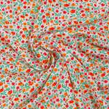 Viscose imprimée jardin secret rouge et orange fond blanc