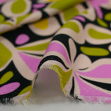 Viscose imprimée Flower Power vert et violet