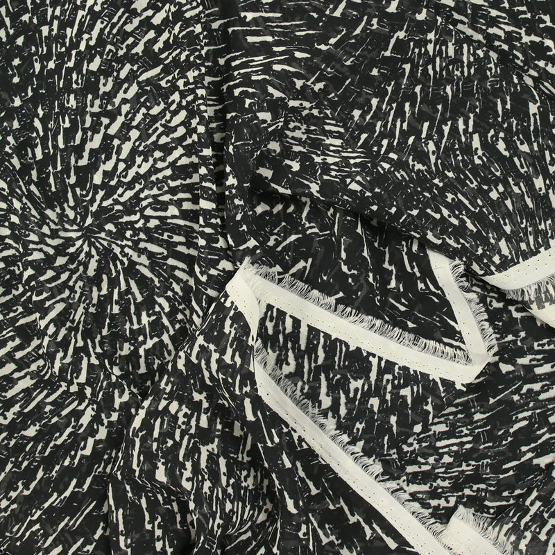 Mousseline imprimée spirales fond noir