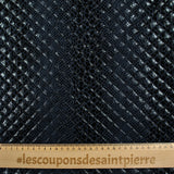 Matelassé imprimé reptile fond bleu marine