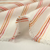 Viscose rayée en dégradé rose, orange et corail fond blanc cassé