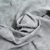 Jacquard de polyester fleurs plumetis gris