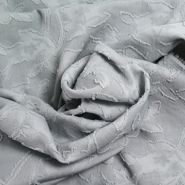 Jacquard de polyester fleurs plumetis gris