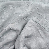 Jacquard de polyester fleurs plumetis gris
