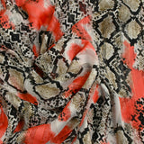 Mousseline imprimée bande satin serpent et tache corail