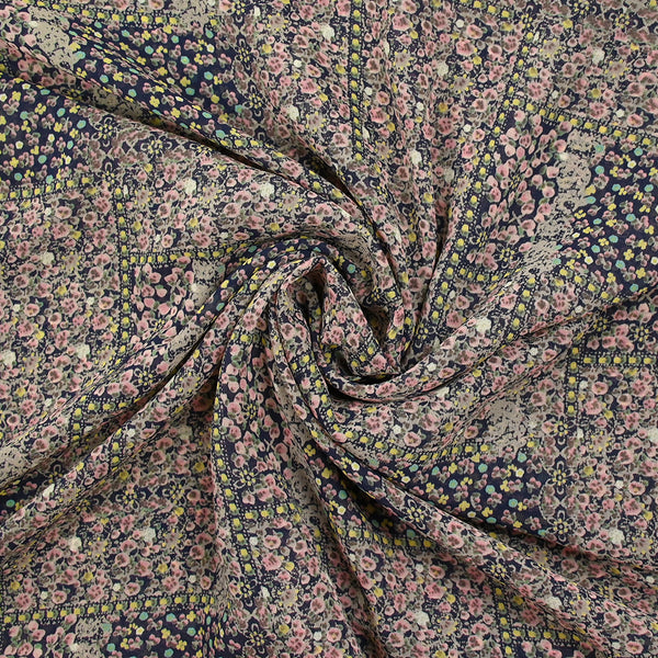 Mousseline imprimée patchwork de fleurs fond marine