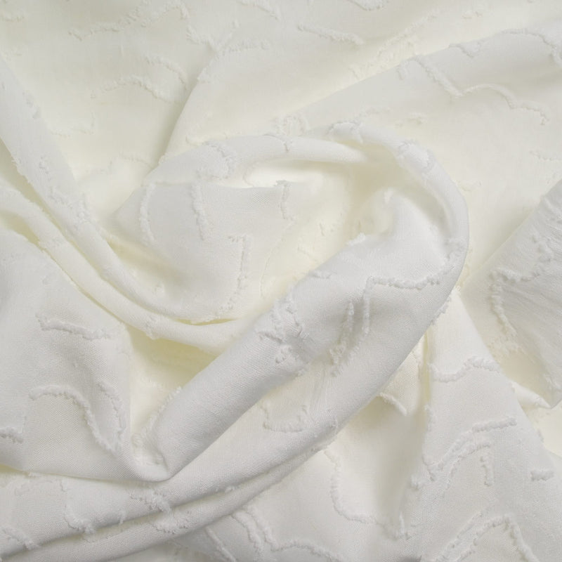 Jacquard de polyester fleurs plumetis blanc