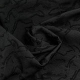 Jacquard de polyester fleurs plumetis noir