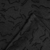 Jacquard de polyester fleurs plumetis noir