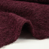 Lainage bouclette à poil long lie de vin