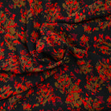 Crêpe polyester imprimé feu fond noir