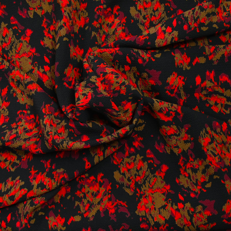 Crêpe polyester imprimé feu fond noir