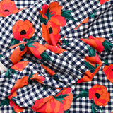 Polyester imprimé à carreaux marine fleurs orange