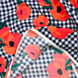 Polyester imprimé à carreaux marine fleurs orange