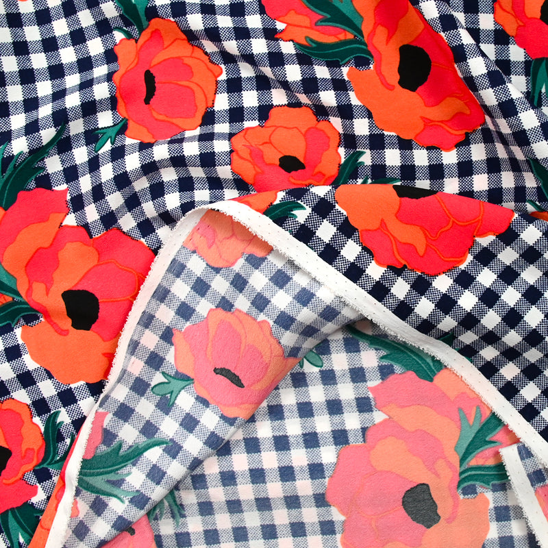 Polyester imprimé à carreaux marine fleurs orange