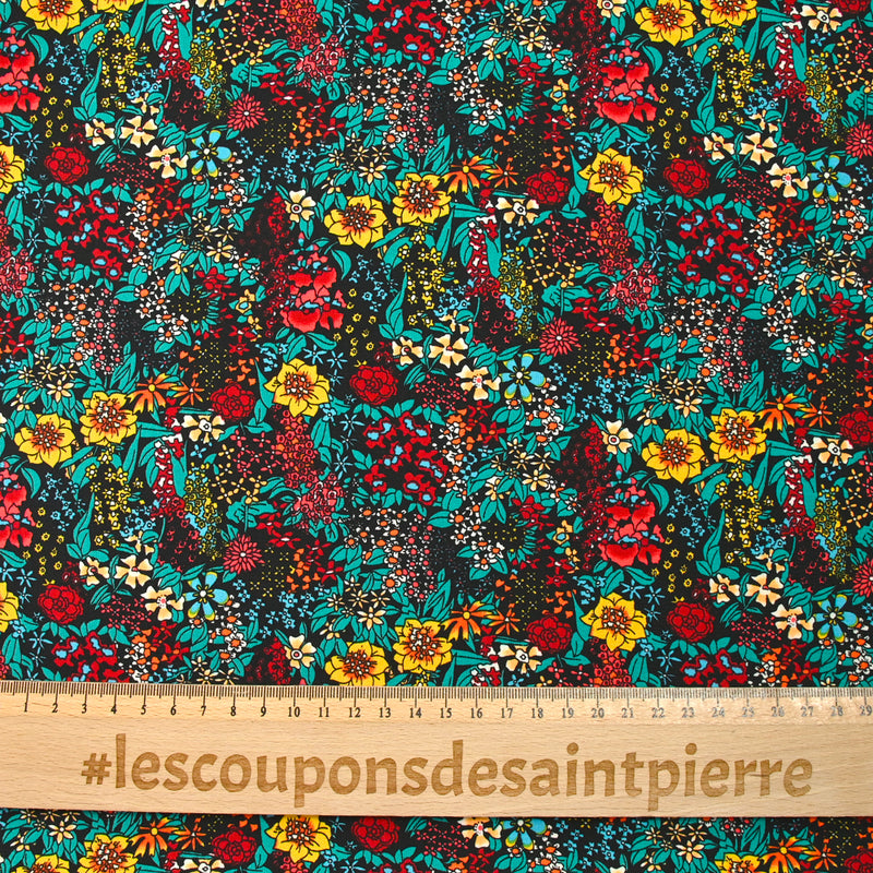 Polyester imprimé tempête de fleurs jaune fond noir