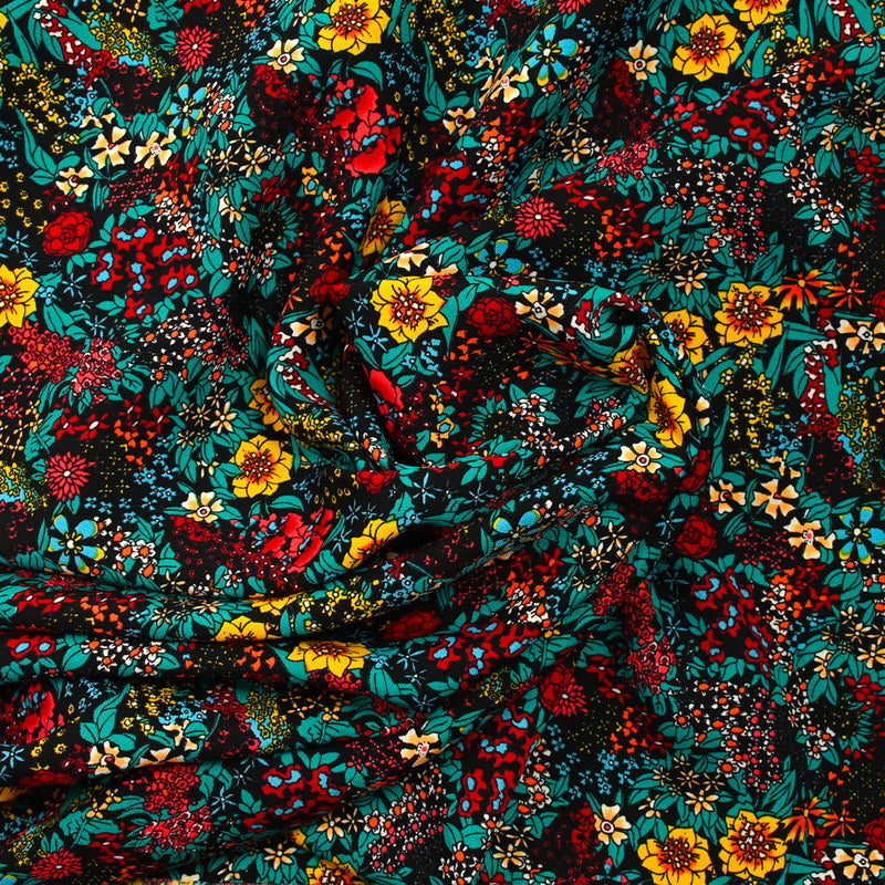 Polyester imprimé tempête de fleurs jaune fond noir
