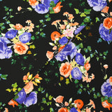 Maille de viscose satinée imprimée fleurs de nuit pêche et bleu fond noir