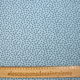 Punto de algodón estampado hojas fondo azul cielo