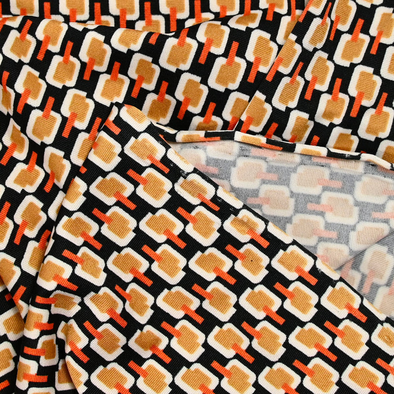 Maille polyester imprimée camel fond noir