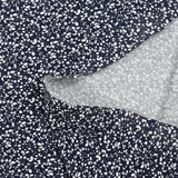 Jersey de coton imprimé branches d'arbre blanc fond bleu nuit