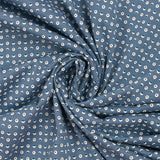 Punto de algodón estampado círculos y medias lunas carro fondo azul