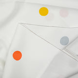 Coton imprimé à pois colorés fond blanc