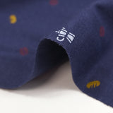 Jersey de coton imprimé café et baguette fond indigo